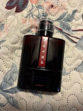 Prada Black Bottle with Deep Red Accent